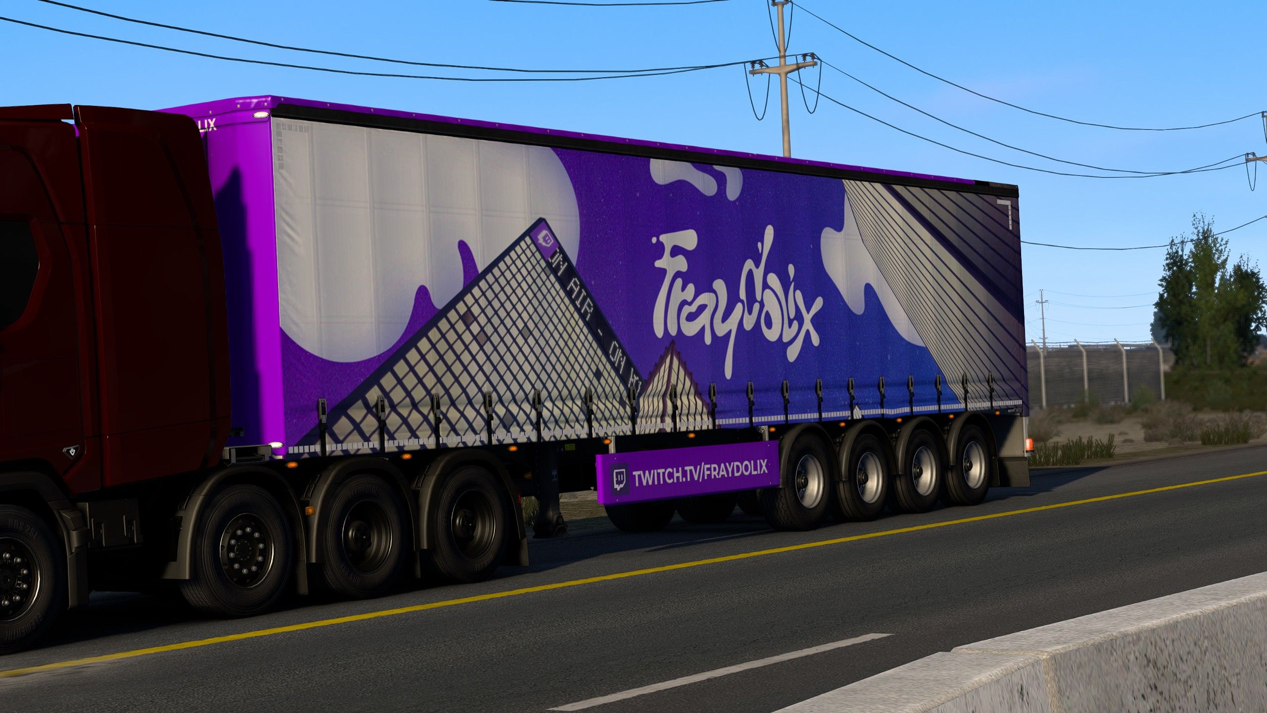 The trailer on the highway, Fraydolix branding visible on its side